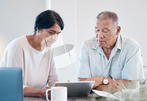 Image of Senior couple, tablet and home of elderly people in retirement looking at web data. Digital, house research and marriage of a Indian woman and man together in a house streaming a internet video