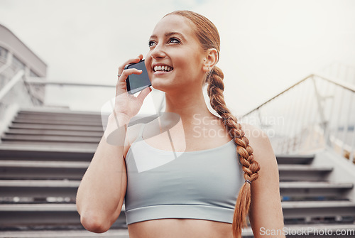 Image of City, fitness and woman with smartphone on call, communication, smile and talking after exercise. Health, workout and personal trainer on phone, conversation and connect or network in sports training