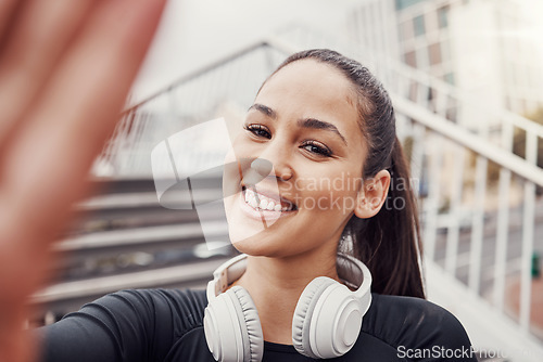 Image of Woman, face and selfie with headphones and fitness in city, happy in Brazil, smile in portrait and exercise outdoor. Runner, cardio and happiness in picture, health and wellness with active lifestyle