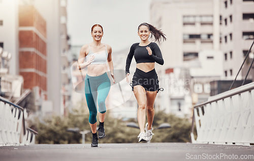 Image of Women are running in city, fitness and cardio outdoor, exercise friends and active lifestyle together. Sport, health and training, runner on urban bridge with healthy people in California and mockup