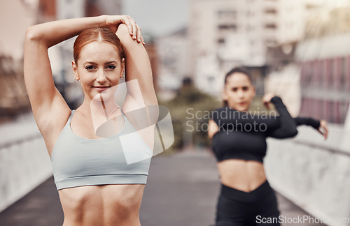 Image of Fitness, friends and women in city stretching for outdoor workout on bridge or road for health and wellness. Sports, motivation and mindset, urban training and people stretch together for exercise.