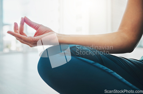 Image of Closeup, hand and woman with meditation, yoga and peace for balance, wellness and healthy lifestyle. Zoom, female yogi and lady in position, pilates training and posture to relax, fitness and calm