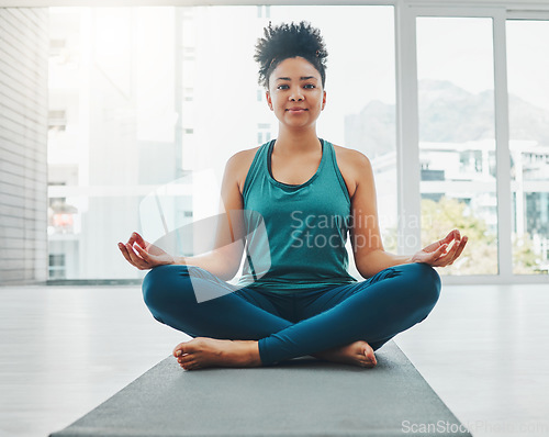 Image of Black woman, yoga portrait and meditation with lotus exercise for fitness, peace and wellness. Young person in health studio for holistic workout, mental health and body balance with zen energy