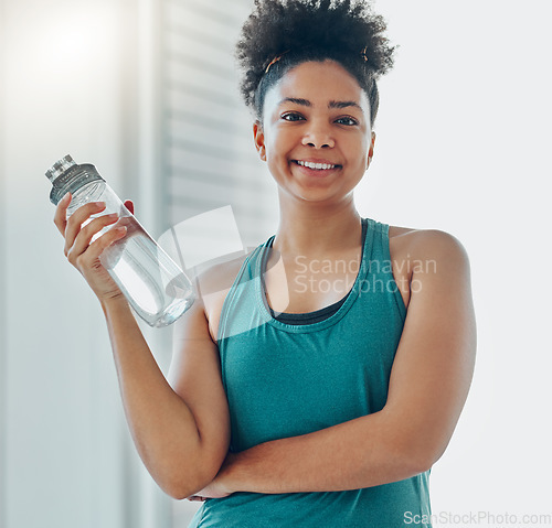 Image of Water, bottle, black woman portrait and of a athlete in a gym after workout and sport. Hydration, drink and healthy young person in a wellness and health center with bottle for training and exercise