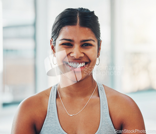 Image of Fitness, happy and portrait of a woman in the gym after a workout for health and wellness. Happiness, smile and headshot of a female model athlete standing in a sport center for exercise or training.