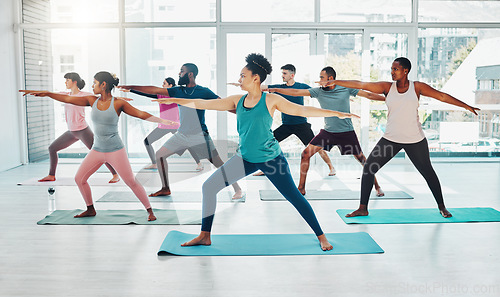 Image of Yoga instructor, exercise class and fitness people in warrior ir stretching for health and wellness. Diversity men and women group together for workout, training or pilates for healthy lifestyle