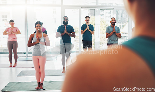 Image of Yoga class, fitness and meditation with diversity people exercise for health and wellness. Men and women in health studio for holistic workout, mental health and body balance with zen prayer hands