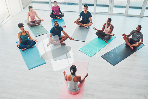 Image of Yoga class, exercise and meditation with people for fitness, health and wellness above. Diversity men and women in health studio for lotus workout, mental health and body balance with zen coach