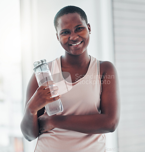 Image of Portrait, black woman and exercise with water bottle, smile and training for wellness, balance or healthy lifestyle. Face, African American female athlete or lady with liquid, happiness and hydration