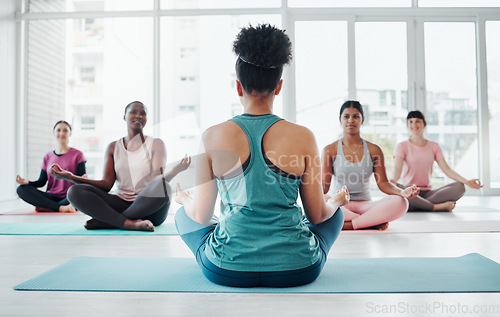Image of Yoga class, fitness instructor and meditation exercise with people in lotus for fitness and wellness. Diversity women in health studio for holistic workout, mental health and body balance or peace