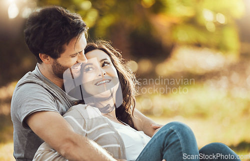 Image of Love, couple and relax at park, laughing at funny joke or comic comedy and having fun time together outdoors. Valentines day, romance hug and care of happy man and woman sitting on romantic date.