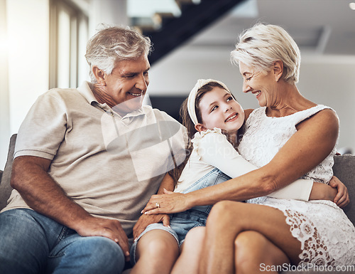 Image of Relax, happy or grandparents hug a girl in living room bonding as a family in Australia with love care. Retirement, smile or elderly man relaxing old woman with child at home together on fun holiday