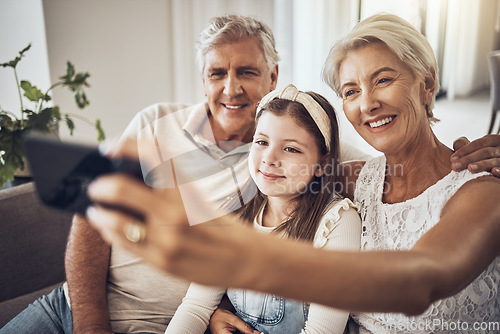Image of Selfie, smile or happy grandparents with girl in living room bonding as a family in Australia with love. Pictures, senior or elderly man relaxing with old woman or child at home together on holiday