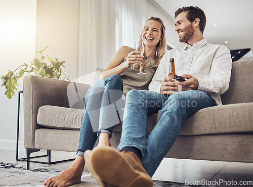 Image of Love, couple on sofa and alcohol to relax, smile and bonding on weekend break, loving and romantic. Romance, man and woman with beer, champagne and celebrate achievement, happiness and in living room
