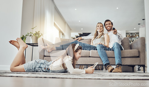 Image of Happy family, relax or child on tablet in living room, house or home live streaming, movies channel or internet show bonding. Smile, parents or kid girl on technology, television or watching tv media