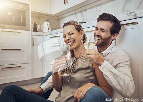 Image of Laughing, love and couple with champagne in the kitchen for celebration, anniversary and valentines day. Comic, relax and funny man and woman drinking alcohol on the floor with happy conversation