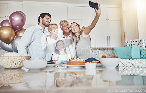 Image of Birthday party, cake and family selfie in kitchen for happy memory, social media or profile picture. Love, food and girl, mother and grandparents taking pictures or photo together to celebrate event.