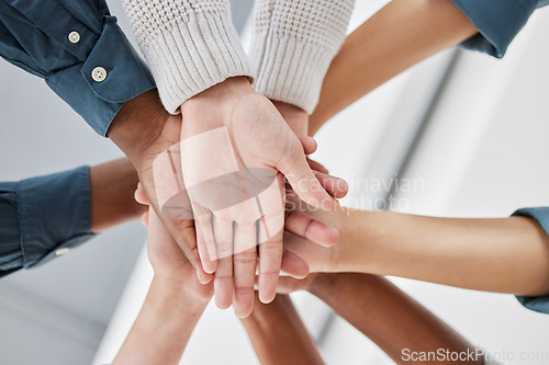 Image of Diversity, collaboration and team stack of hands for celebration, motivation or partnership. Multiracial, teamwork and business people celebrating together for success, achievement or goal in office.