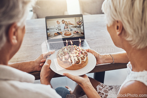 Image of Birthday, cake and couple on video call on laptop for party, celebration or event in home. Big family, senior or man and woman holding food while talking to people on computer in online conference.