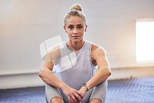 Image of Gym portrait, woman focus and workout of a athlete sitting with a smile ready for sports. Wellness, training and fitness club with a young person with happiness and health motivation for sport