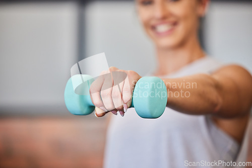 Image of Training, workout and woman with dumbbell closeup at the gym for muscle, strength and wellness at fitness club. Hand, lifting and exercise by fit female athlete with power, energy and motivation