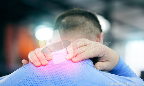 Image of Fitness, gym and man with pain in neck, medical emergency during gymnastics workout at sport studio. Exercise, health and wellness, person with hand on back muscle cramps or injury while training