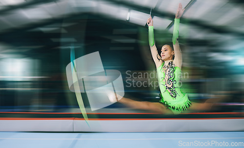 Image of Gymnastics, fitness and woman with jump and motion blur, sport in gym or arena with action and speed. Athlete, moving and mockup space with gymnast, flexibility and pose with sports and splits in air