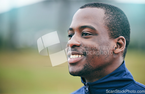 Image of Happy, sports and coach by black man thinking on a field for fitness, exercise and training with mock up. Face, mindset and goals of a personal trainer outdoors for workout, performance and match