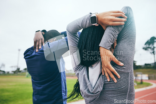 Image of Fitness, back and black couple stretching arms outdoors for health and wellness at track. Winter sports, training and man and woman warm up, prepare or get ready to start exercise, workout or running