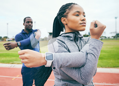 Image of Fitness, black couple and stretching arms for exercise, health and wellness at stadium. Winter sports, training or man and woman prepare and get ready to start workout, running or exercising outdoors