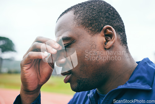 Image of Headache, fitness and burnout with a sports black man holding his nose during an outdoor workout. Stress, exercise and mental health with a male runner or athlete training for cardio or endurance