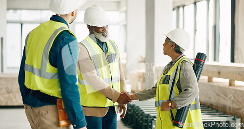 Image of Handshake, architecture and engineering team shaking hands with a project development designer in a building. Global, b2b and happy construction workers in meeting or partnership deal with contractor