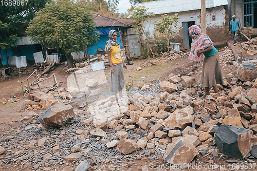 Image of Ethiopian mans resting behind house