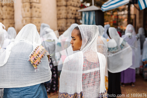 Image of Orthodox Christian pilgrim at worship on the street during easter