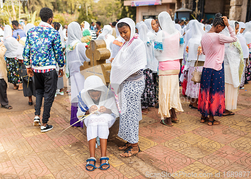 Image of Orthodox Christian pilgrim at worship on the street during easter