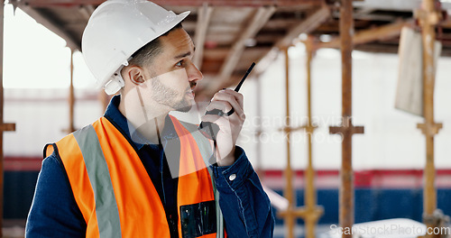 Image of Logistics worker, walkie talkie and man on a construction site working on a building project. Architecture, communication and engineer talking on a radio while doing home maintenance or renovation.