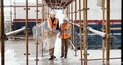 Image of Construction worker, working together and conversation with tablet, communication and construction business. Engineer, job site with man and woman talking, collaboration and building trade.