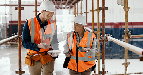 Image of Construction worker, working together and conversation with tablet, communication and construction business. Engineer, job site with man and woman talking, collaboration and building trade.