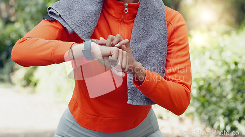 Image of Woman sports runner with smartwatch for exercise, tracking running time and heart beat after training workout for fitness. Healthy fit girl athlete with watch for timer to track performance progress