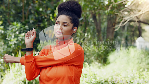 Image of Black woman stretching in the park for fitness, health and wellness before a run. Exercise, sports and female athlete warm up training outside or in nature for mobility, flexibility and strength.