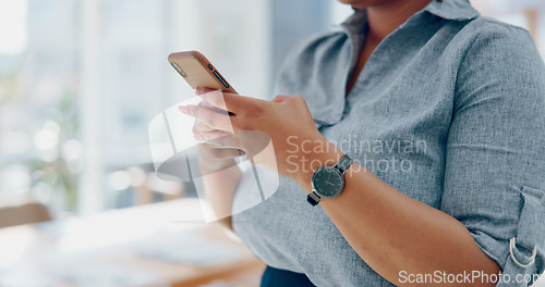 Image of Business woman, hands and phone in social media texting for communication, chatting or browsing at the office. Hand of female employee typing, searching or online conversation on mobile smartphone