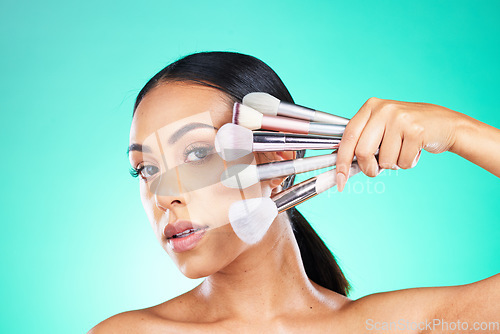 Image of Beauty, makeup brush and portrait of woman in studio for skincare or grooming on green background. Face, skin and girl model relax with glamour tool, product or luxury makeover on isolated mockup