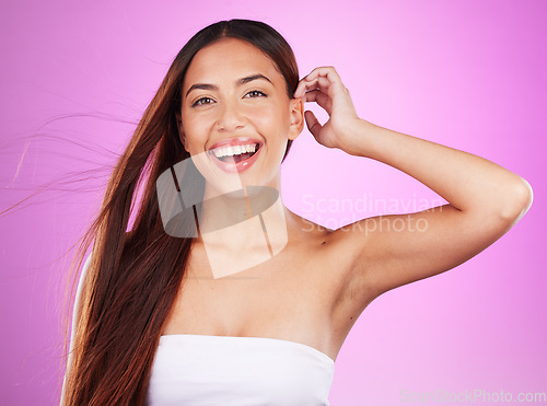 Image of Hair care, cosmetics and portrait of a woman with a glow isolated on a pink background in a studio. Smile, salon and hairdresser model showing a hairstyle from a spa for grooming and brunette style