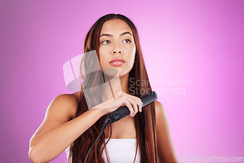 Image of Hair, flat iron and face of girl on purple background for wellness, cosmetics and beauty treatment. Salon aesthetic, hairdresser and girl with heat product for healthy, shine and natural hair style