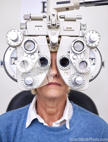 Image of Senior woman patient, eye test and phoropter in hospital, optometrist office or clinic for vision healthcare. Optician tools, elderly lady or medical lens device for customer, client or consumer eyes