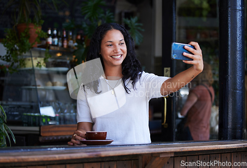 Image of Woman at cafe, smile in selfie with smartphone, social media post with lifestyle or food influencer with coffee. Tech, phone photography and happy in picture, brand promotion for online community