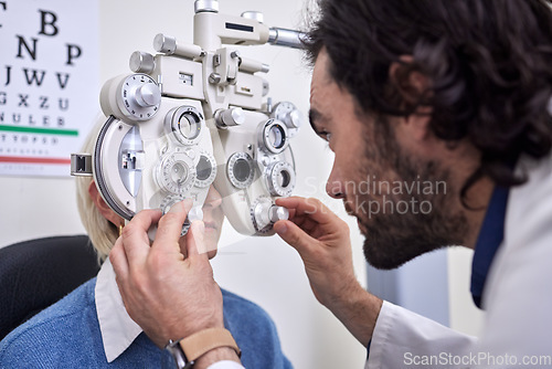 Image of Eye exam, test and patient with doctor for vision at optometry consultation for lens or frame. Woman and man in healthcare with machine for eyes with health insurance and expert ophthalmology care