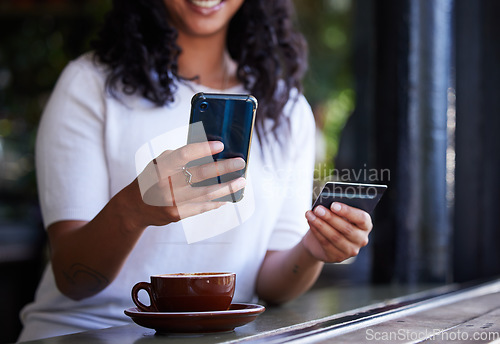 Image of Woman, hands and phone with credit card for online shopping, ecommerce or purchase at coffee shop. Hand of female customer on smartphone for internet banking, app or wireless transaction at cafe