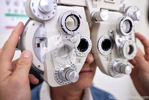 Image of Eye care, exam and vision test machine with patient and doctor at optometry consultation for lens or frame. Hands of man healthcare person with equipment for eyes and health insurance for eyewear