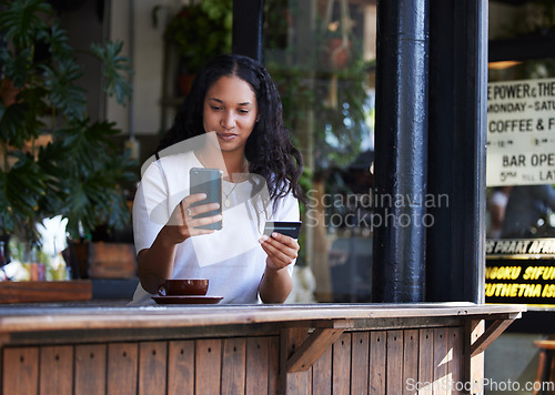 Image of Woman, phone and credit card at cafe for ecommerce, online shopping or purchase. Happy female customer on smartphone for internet banking, app or wireless transaction at coffee shop or restaurant